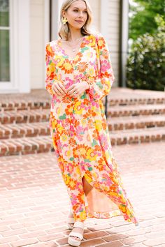 This long-sleeve maxi dress is stunning with its bright, colorful floral print! The elastic waist offers a flattering silhouette, accentuating your figure while offering a comfortable fit. Whether it's fancy brunch with the girls or a romantic dinner, this dress brings a touch of elegance to any occasion. This maxi dress features long bubble sleeves, a v-neck, side slit, elastic waist, and a bold floral print.
Material has no amount of stretch.Cam is wearing the small. Fancy Brunch, Yellow Floral Maxi Dress, What Shoes To Wear, Gorgeous Maxi Dresses, Floral Cocktail Dress, Bold Floral Print, Black Tie Dress, Long Sleeve Outerwear, Two Piece Swimwear