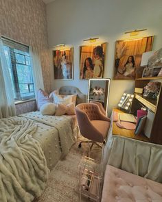 a bed room with a neatly made bed and pictures on the wall