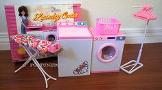 there is a doll house with laundry and washing machines