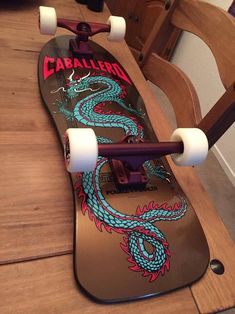 a skateboard sitting on top of a wooden table