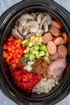 the crockpot is filled with meat, vegetables and seasonings to make this meal