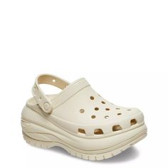 These women's Crocs Classic Mega Crush bone (light beige) platform clogs can get you going on your everyday adventure. Featuring lightweight EVA upper, these round-toe clogs have perforations for flushing out water, pivoting heel strap, supportive EVA lining, responsive EVA midsole and ultralight, enhanced rubber outsole. Proprietary Croslite technology impressively absorbs impact, ensuring optimal cushioning support. Iconic Crocs Comfort offers lightweight, flexible and 360-degree comfort. Customizable with Jibbitz charms (charms sold separately). | Crocs Women's Mega Crush Clog in Bone Size 6 Medium Mega Crush Clog, Boston Clogs, Snowboarding Accessories, Crocs Classic Clogs, Platform Clogs, Women's Crocs, Cycling Fashion, Running Fashion, Clog Sandals