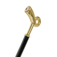 a black and gold pen with a diamond on it