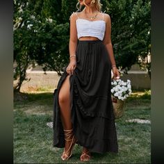 Bohemian Black Skirt For Day Out, Black Ruffled Maxi Skirt For Summer, Casual Black Ruffled Maxi Skirt, Black Tiered Skirt For Brunch, Flowy Black Maxi Skirt For Summer, Black Flowy Maxi Skirt For Summer, Chic Black Maxi Skirt For Vacation, Flowy Black Maxi Skirt For The Beach, Elegant Black Maxi Skirt For Vacation