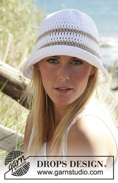 a beautiful blonde woman wearing a white hat