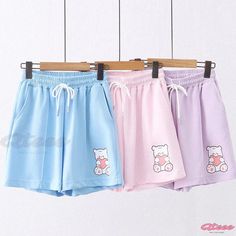 Qteee - Heart-Shaped Bear Embroidered Pocket Drawstring Shorts - A Darling Addition to Your Wardrobe Summer Casual Bottoms With Cartoon Print, Cute Cotton Bottoms With Cartoon Print, Kawaii Style Cotton Bottoms For Summer, Kawaii Cotton Bottoms For Summer, Kawaii Cotton Summer Bottoms, Blue Cartoon Print Bottoms For Summer, White Cartoon Print Bottoms For Summer, Casual Bottoms With Cartoon Print For Spring, Casual Spring Bottoms With Cartoon Print