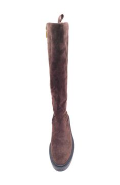 Stride through the city in style in this timeless knee-high boot crafted with a side zipper for easy wear and a lugged rubber sole. 1 1/2" heel 15" shaft Leather upper and lining/rubber sole Imported Brown Wide Calf Knee-high Boots With Zipper, Suede Knee-high Boots With Zipper Closure, Knee-high Suede Boots With Zipper Closure, Fall Knee-high Boots With Side Zipper, Kenneth Cole Reaction, Kenneth Cole, Easy Wear, Knee High Boots, Side Zipper