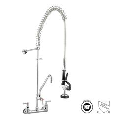 a kitchen faucet that is attached to the side of a sink with an extension hose