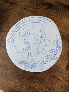 a paper plate with a drawing of a man and woman on it