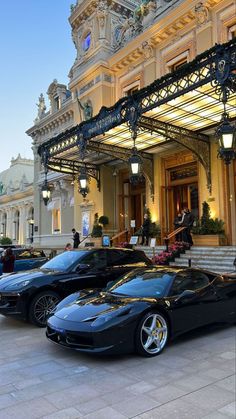 some very nice looking cars parked in front of a building