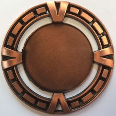 a metal object that looks like a circle with an arrow on the center and sides