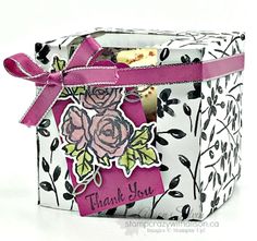 a small gift box with some flowers on it