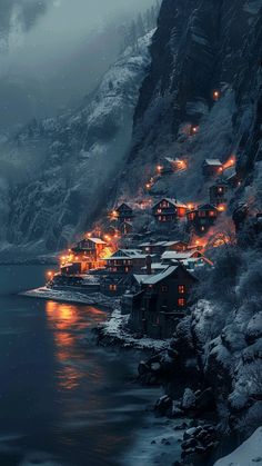 an image of a snowy mountain town by the water at night with lights on it