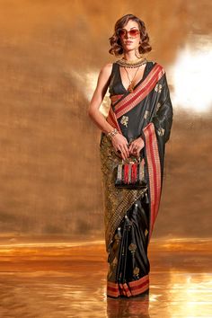 About this Product Saree: Saree Type: Ready to wear saree, Pre-stitched Saree Color: Black Saree Fabric: Pure Satin Type of Work: Foil-Print Drape Style: Choose the drape style while order: Standard Open, Pleated or Gujarati Saree length: 5.5 meters Petticoat: Saree comes with an in-built butter crepe petticoat, no additional petticoat is required to wear with the saree. Sizing: Waist is adjustable +/- 1 size with a partial elastic waist band that falls under the drape for added comfort. Blouse: Black Silk Saree Look, Silk Saree Look, Black Silk Saree, Satin Sarees, Bridesmaid Saree, Handloom Weaving, Party Sarees, Black Pure, Ready To Wear Saree