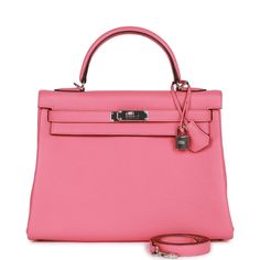 This Kelly, in the Retourne style, is in Rose Azalee clemence leather with palladium hardware and has tonal stitching, two straps with front toggle closure, clochette with lock and two keys, single rolled handle and removable shoulder strap.The interior is lined with Rose Azalee chevre and features one zip pocket with an Hermes engraved pull and two open pockets on the opposite side.Collection: YOrigin: FranceCondition: New and never worn (Plastic on hardware)Accompanied by: Hermes box, Hermes dustbag, clochette, lock, two keys, shoulder strap, clochette dustbag, shoulder strap dustbag, carebook and feltMeasurements: 12.75" width x 9" height x 4.75" depth; 3.5" handle drop (16.5" shoulder strap drop) Book Closet, Hermes Kelly Retourne, Hermes Box, Hermes Bags, Wallet Case, Zip Pockets, Dust Bag, Fendi, Shoulder Strap