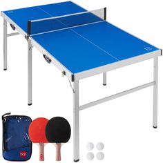 two ping pong paddles and one table tennis racket set up for play