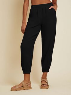 Perfect for whatever you have planned, these breezy, Double Gauze joggers are about to become your new go-to. Hip pockets, and elastic at the waist and ankle. (These come in Black.) Wear it with the Skyla Tank. | Women's Cairo Pant in Black | Ethical Essentials Solid Tapered Leg Joggers With Elastic Waistband, Solid Color Tapered Leg Joggers With Elastic Waistband, Summer Joggers With Elastic Waistband For Loungewear, Summer Relaxed Fit Tapered Leg Joggers, Relaxed Fit Tapered Leg Summer Joggers, Summer Relaxed Fit Sweatpants With Elastic Cuffs, Summer Tapered Leg Sweatpants With Elastic Waistband, Comfortable Tapered Leg Joggers With Elastic Waistband, Comfortable Summer Joggers With Elastic Waistband