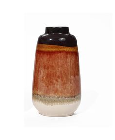 a brown and black vase sitting on top of a white table