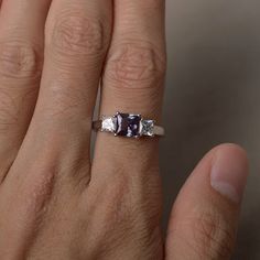 This is a gorgeous handmade creation. Its beauty is its simplicity & Elegance. The 6*6 mm princess cut faceted lab Alexandrite is crafted in solid sterling silver and with rhodium plated. All item is sent in a beautiful gift box If you have any idea of design your ring,pls contact me directly. You can realize more lovely stuff clicking the link https://www.etsy.com/shop/knightjewelry?refshopsection_shophome_leftnav Please leave the correct address and you phone number for delivering successf Cubic Zirconia Asscher Cut Ring With Accent Stones, White Gold Asscher Cut Ring With Accent Stones, Asscher Cut White Gold Ring With Accent Stones, Princess Cut Diamond Ring With Accent Stones For Promise, Radiant Cut Gemstone Ring For Anniversary, Anniversary Sapphire Ring Square Cut, Radiant Cut Gemstone For Wedding And Anniversary, Princess Cut Jewelry With Accent Stones, Anniversary Square Cut Sapphire Ring