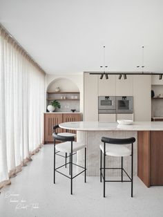 the kitchen is clean and ready to be used as a dining room or living area