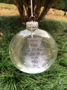 a glass ornament hanging from a tree with the words, you are the most bright star in the sky