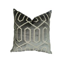 a gray and white pillow on a white background