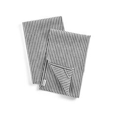 two black and white striped napkins sitting on top of each other