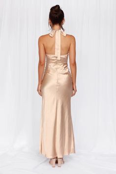 Length from top of bust to hem of size S: 128cm. 
 Chest: 38cm, Waist: 30cm, across front only of size S. 
 Maxi dress. 
 Lined. 
 Model is a standard XS and is wearing size XS. 
 True to size. 
 Non-stretch. 
 Luxurious satin. 
 Halter neck tie. 
 Elastic back. 
 Split to skirt. 
 Straight, flowy silhouette. 
 Zipper with hook eye closure.  
 Cold hand wash only. 
 Polyester. 
 This material is very delicate. Please handle with care. 
 Please Note: This product is a Exclusive.  
 
 Step into a Champagne Bridesmaid Dresses Halter Neck, Champagne Halter Dress, Bridesmaid Dresses Halter Neck, Dress Pro, Halter Top Dress, Candy Dress, Skirt Straight, Champagne Bridesmaid Dresses, Dress Champagne