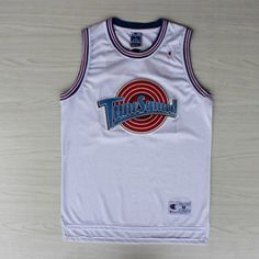 a basketball jersey hanging on the wall in front of a white background with blue and red stripes