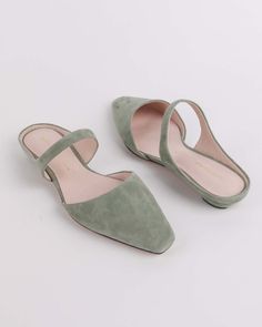 sage suede kitten heel mule with strap and open back Chic Slip-on Mules With Low Heel, Modern Low Heel Mules With Heel Loop, Slip-on Kitten Heels For Work, Spring, Spring Workwear Slip-on Kitten Heels, Chic Slip-on Flats With Heel Strap, Chic Pointed Toe Slip-on Flats With Sculpted Heel, Chic Slip-on Pointed Toe Flats With Low Heel, Chic Low Heel Slip-ons With Leather Sole, Spring Slip-on Kitten Heels With Sculpted Heel