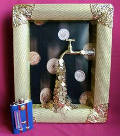 a photo frame with coins and a faucet