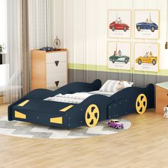 a child's bedroom with a race car bed