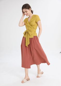 "Add a pop of color to your wardrobe with our yellow V-neck linen fitted short sleeve top. The fitted design hugs your curves in all the right places, while the breathable linen fabric keeps you feeling cool and comfortable. The V-neckline adds a touch of elegance, making it the perfect top for any occasion. Pair it with your favorite jeans or a skirt for a chic and effortless look. DETAIL: * 100%Linen * V neckline * Short sleeve * Loose linen shirt * Wrap blouse * Perfect for Spring, Summer, an Yellow Cotton V-neck Blouse, V-neck Linen Blouse For Summer, V-neck Linen Blouse For Work, Casual Yellow Linen Blouse, Casual Mustard V-neck Blouse, Yellow Linen Summer Tops, Yellow Linen Tops For Spring, Linen Wrap Top Pattern, Blouse Summer Outfit