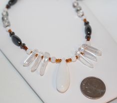 White Jade drop and accents with Quartz Crystal Shards, Tourmalated Quartz, Magnetic Hematite, and honey colored glass seed bead Tribal style necklace.  19 inches long with a gunmetal lobster clasp. Arrives gift boxed with a jewelry pouch. https://www.etsy.com/shop/shimmershimmer White Crystal Necklace, Jade Magnetic Hematite Quartz Necklace, Tribal Style Jewelry, Gift for Man or Woman Unisex Jewelry, Shimmer Shimmer #574 Quality craftsmanship that is top notch with over 20 years in professional White Crystal Necklace, Crystal Shard, Tourmalated Quartz, Jade Crystal, Professional Jewelry, White Jade, White Necklace, Original Jewelry, Unisex Jewelry