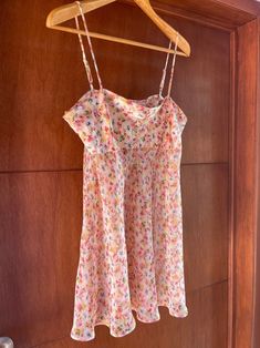 Beautiful vintage pink floral semi sheer dress with silky top, adjustable spaghetti straps and flowing short skirt! Perfect for lingerie or can be worn as a top paired with shorts! Excellent vintage condition  Fits best M/L  100% polyester  Measurements taken across: armpit to armpit: 19" waist: 25" length: 20" Pink Cami Mini Dress With Adjustable Straps, Sheer Cami Summer Dress, Feminine Cami Slip Dress For Spring, Spring Sheer Camisole Slip Dress, Sheer Camisole Slip Dress For Spring, Summer Pink Slip Dress With Delicate Straps, Sheer Cami Slip Dress For Summer, Pink Sheer Slip Dress For Summer, Summer Floral Print Slip Dress With Spaghetti Straps