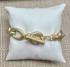 Glam up your wrist with our Salina Gold Link Bracelet! One has textured links and toggle clasp (7" in length). Second one has smooth links with lobster clasp (adjustable up to 8"). Whether you prefer textured or smooth, we've got a style to dazzle your outfits with a pop of glam. Choose from two lengths and a toggle or lobster clasp closure. Gold-tone Toggle Clasp Chain Link Necklace, Formal Gold-tone Chain Bracelet With Toggle Clasp, Classic Gold-tone Bracelets With Toggle Clasp, Gold-tone Metal Bracelet With Toggle Clasp, Gold-tone Metal Chain Link Charm Bracelet, Deodorant Stains, Gold Link Bracelet, Makeup Stain, Gold Link