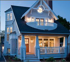 the front and side of a house at night