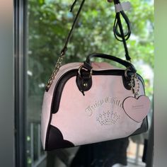 Juicy Couture Speedy Satchel Very Gorgeous Bag! Firm Price As It’s Htf Blush Pink & Brown Juicy Couture Color With Logo Wording Embroidered Gold Tone Hardware Double Rolled Carry Handles W/ 4.5” Drop Adjustable Crossbody Strap W/ 23” Drop Top Zip Closure Fabric Lined Interior W/ 1 Zipper Pocket And 1 Slip Pocket 10”W X 9”H X 5.5”D Condition: New With Tags Msrp $99 Shipping:Fast Juicy Purse, Pink And Brown Juicy Couture Bag, Juicy Couture Crossbody Bag, Bling Purses, Juicy Couture Daydreamer Bag Pink, Y2k Juicy Couture Bag, Juicy Couture Handbags, Juicy Couture Bags Black, Juicy Couture Baby