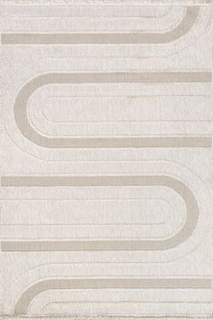 an area rug with wavy lines in grey and white on top of a beige background