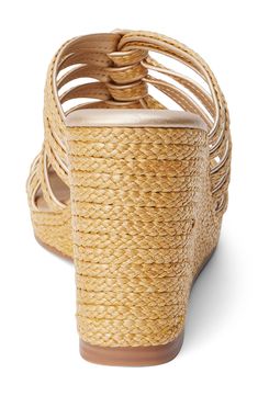 Braided raffia straps weave into one another on this stunning wedge sandal that'll have you ready to hit the cabana in style. 3 3/4" heel; 3/4" platform Textile upper/synthetic lining and sole Imported Summer Vacation Heels With Braided Straps, Natural Synthetic Wedge Sandals For Beach Season, Elegant Wedge Sandals For Beach Season Vacation, Elegant Wedge Sandals With Wrapped Heel For Vacation, Vacation Heels With Braided Straps, Vacation Heels With Braided Straps And Open Toe, Straw Wedge Sandals For Vacation, Chic Wedge Sandals With Braided Straps For Vacation, Elegant Adjustable Wedge Sandals For Vacation