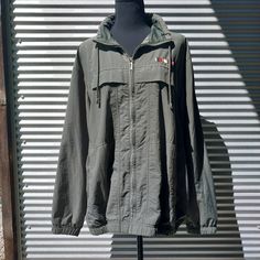 Early 2000s Catalina windbreaker in olive. Features two pockets with velcro closure, nautical bar detail, and hanging loop.  Polyester mesh lined with crepe nylon shell. Feels so light and comfortable. Perfect for seasonal transitions and cool summer nights. Great condition. No holes. rips, snags,or stains. Previously worn and well cared for. :SIZING: Marked Women's XL. Laid flat to measure FRONT SIDE ONLY  Measures Approximately: PIT TO PIT 26 1/2" LENGTH 26 1/2"  :SHIPPING: All orders ship for free same or next day by USPS. Green Utility Windbreaker For Streetwear, Military Style Hooded Windbreaker For Spring, Military Style Spring Windbreaker For Outdoor, Military Style Windbreaker For Spring Outdoor Activities, Spring Military Style Windbreaker For Outdoor Activities, Spring Military Windbreaker For Outdoor Activities, Military Style Khaki Windbreaker For Spring, Spring Military Windbreaker With Pockets, Green Military Style Windbreaker For Streetwear