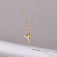 Indulge in celestial elegance with our Tiny Diamond Cross Star Necklace, meticulously crafted in 14k Solid Gold. This dainty piece features a delicate compass pendant adorned with sparkling diamonds, adding a touch of sophistication to any ensemble. Handmade with care, it serves as a timeless symbol of guidance and faith, making it the perfect accessory for Her. Elevate your jewelry collection with this exquisite necklace, designed to capture hearts and inspire wonder with its celestial allure. Star-shaped Celestial Jewelry For Formal Events, Celestial Star-shaped Jewelry For Formal Occasions, Celestial Star Jewelry For Formal Occasions, Celestial Pendant, Timeless Symbol, Compass Pendant, Compass Necklace, Tiny Diamond, Diamond Cross