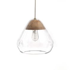 a clear glass and wood light hanging from a ceiling fixture with a brown wooden handle