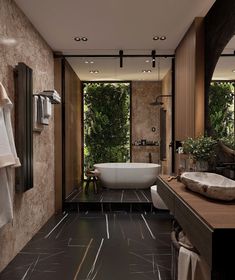 a bathroom with a tub, sink and large mirror on the wall next to it