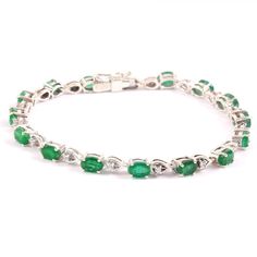 "=> Gemstone Type - Natural Zambian Emerald => Gemstone Weight - Approximately 10 ct => Metal Type - 925 Sterling Silver. => Side Stone - Natural White Topaz => Stone Measurement Available - 6mmx4mmm => Shape - Oval Cut Shape => Bracelet Weight - 13.00 Gram To change the metal to a solid gold (white/rose) or platinum is also available, please ask for a quotation if you want. Emerald Is a May birthstone. Emerald is known as the \"stone of successful love\". It brings loyalty and provides for dome Fine Jewelry Tennis Bracelet With Oval Links For Anniversary, Oval Tennis Bracelet With Prong Setting For Anniversary, Anniversary Tennis Bracelet With Oval Links, Anniversary Tennis Bracelet With Oval Links In Fine Jewelry, Oval White Gold Tennis Bracelet For Anniversary, Classic Oval Gemstone Tennis Bracelet, Oval Tennis Bracelet For Anniversary, Oval Tennis Bracelet For Anniversary, Fine Jewelry, Anniversary Oval Tennis Bracelet Fine Jewelry