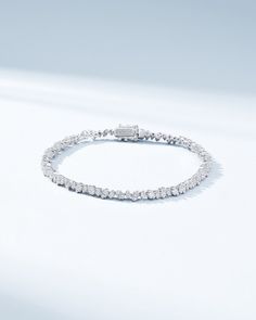 Experience the charm of the night sky with our La Fantaisie Cosmic Tennis Bracelet. Set with 2.95 carats of princess-cut diamonds, this bracelet radiates continuous brilliance. Its sleek design captures the magic of the stars, making it perfect for day or night. Details 18k yellow gold, rose gold or white gold 2.95 carats of princess-cut white diamonds Bracelet measures 7 inches in length Box clasp with safety lock fastening 3.6mm width Ref: AKB597D Sterling Silver Bracelet With Sparkling Stones, Luxury White Diamond Bracelet With Sparkling Stones, Luxury Diamond White Bracelet With Sparkling Stones, Diamond Bracelet With Sparkling Round Cut Stones, Diamond Bracelets With Sparkling Round Cut Stones, White Gold Moissanite Jubilee Bracelet, Luxury White Gold Crystal Jubilee Bracelet, Moissanite Jubilee Bracelet In Fine Jewelry Style, Fine Jewelry Moissanite Jubilee Diamond Bracelet