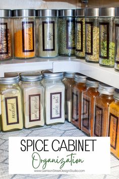 spice cabinet organization with jars filled with different types of spices and seasonings in them