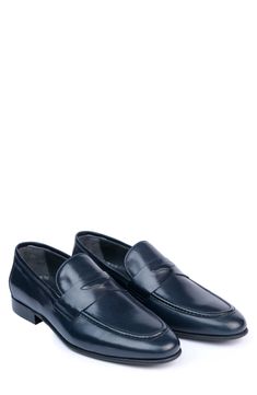 Handmade of smooth leather, this moc-toe dress shoe with a classic penny loafer silhouette offers a sophisticated, elegant look. Leather upper and lining/synthetic sole Made in Turkey Classic Blue Slip-ons For Business, Blue Classic Wingtip Tassel Loafers, Classic Blue Wingtip Tassel Loafers, Blue Plain Toe Loafers For Semi-formal Occasions, Semi-formal Blue Loafers With Rubber Sole, Blue Wingtip Moccasins For Business, Classic Blue Tassel Loafers For Business, Blue Classic Tassel Loafers For Business, Blue Business Loafers With Rubber Sole