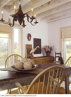 a dining room table with chairs and a plate on it