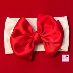 Beautiful Red Satin Ribbon Bow on a wide White Nylon Headband for daily wear or any special occasion!!   🎀  This item is also available as a single Hair Bow on an alligator clip.  🎀  These nylon headbands are hand sewn, with limited seams on the headband means maximum stretch for ultimate comfort.   🎀  The Nylon headband will easily stretch to fit your little girl as she grows.  🎀  The Bow size is approximately 4.5 to 5" wide and the nylon headband measures 3" wide 🎀 Nylon Headband Bow Size Adjustable Solid Hair Accessories With Matching Headband, Adjustable Red Bow Hair Accessories, Adjustable Red Hair Accessories With Bow, Red Bow Hair Accessories, Adjustable Bow Headband As Gift, Adjustable Bow Headband Gift, Pink Satin Bow Headband Gift, Adjustable Red Bow Hair Accessories For Gift, Adjustable Red Bow Hair Accessory Gift